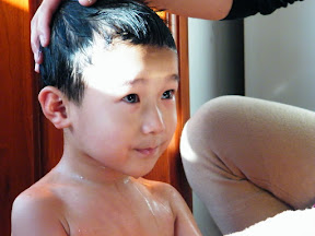 baby washing head.