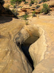 A pothole in the side canyon
