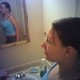 Me in the bathroom showing off the length of my hair and girth of my paunch.  (2006)