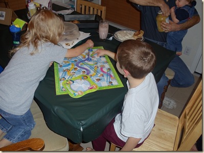 Heather and Travis playing Chutes & Ladders