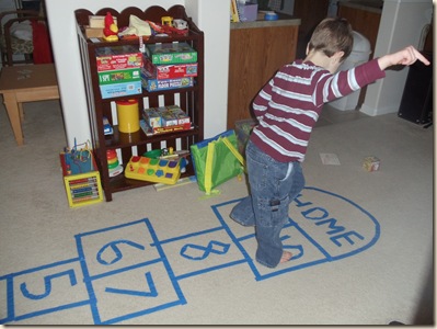 Traivs doing hopscotch