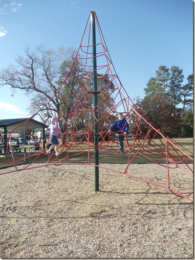 Travis and Heather climbing the "spider web"