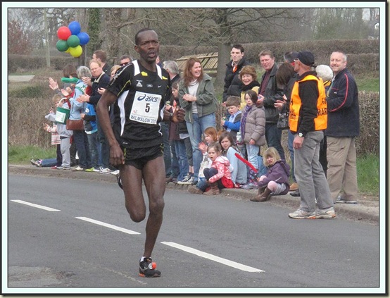 Jean Ndayisenga at the 13 mile mark on his way to winning the Wilmslow Half Marathon - 2011, in 1.04.24