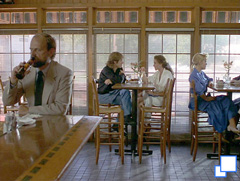 Ann and Graham talking in a cafe