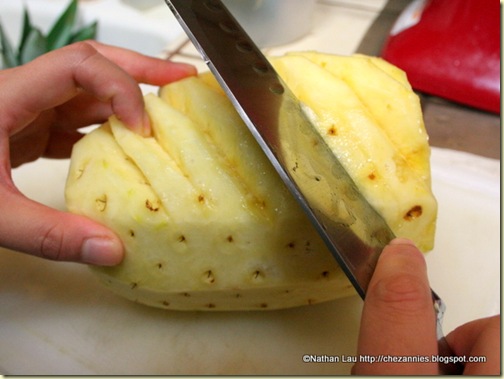  Cutting Grooves into the Pineapple to Remove the Eyes