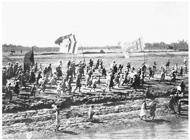 Riots in Sudan, 1924. Anti-British protestors run along the banks of the Atbara River in Sudan on September 1, 1924. Troops and ships were rushed to the scene to quell the disorders.  