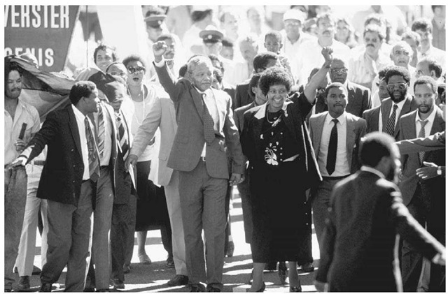 Nelson Mandela Leaves Prison. Mandela, hand-in-hand with then-wife Winnie Mandela, parades past a jubilant crowd shortly after his release from prison on February 11, 1990.