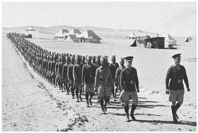 Indian Troops in Egypt. British officers lead a line of Indian soldiers from their camp in Egypt in March 1940. These troops were the first from the British Empire to take up occupation in North Africa.