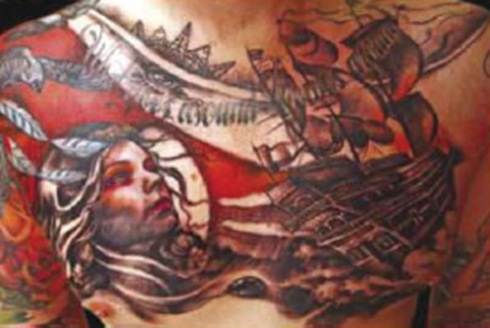 extreme tattoo on male body