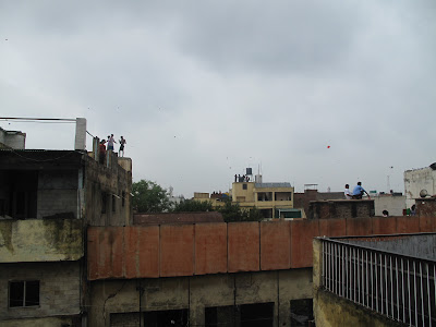 Flying kites from rooftops