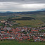 The village of Spiske Podhradie as seen from the Spissky Hrad Castle. The Vysoke Tatry (High Tatra) Mountains in the background to the right.