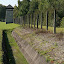 [EN] Dachau, Germany. Former concentration camp - The trench, followed by barbed wire, followed by electrified fence. [SK] Dachau, Nemecko. Byvaly koncentracny tabor - Priekopa nasledovana ostnatym drotom a elektrickym plotom.