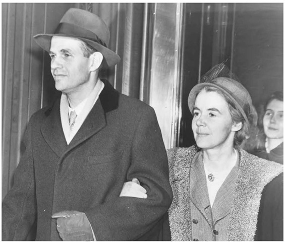 Alger and Priscilla Hiss leave a New York federal court arm in arm.