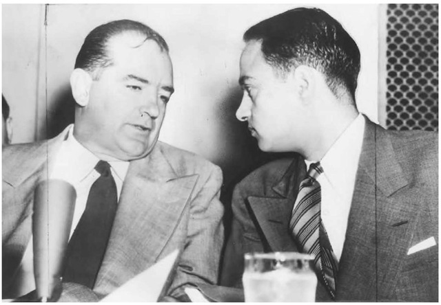 Senator Joseph McCarthy chats with his attorney, Roy Cohn, during Senate subcommittee hearings on the McCarthy-Army dispute. 