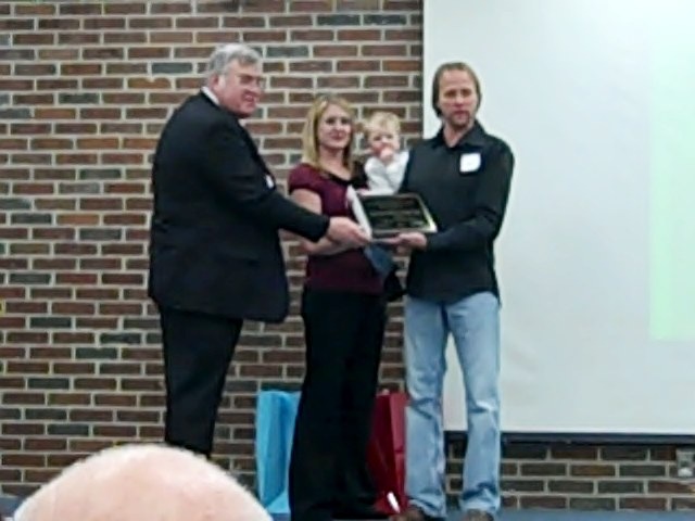 [Bill and Sara Frost accept award during Logan Co. Children Service's Holiday Party 0 00 51-14[5].jpg]