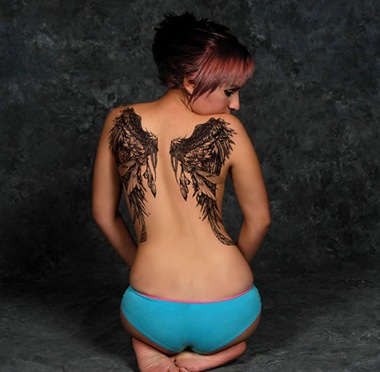Girl tattoo That girl has a dark angel wings tattoo with an innovative 