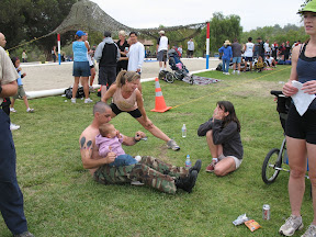 Mary stretches while Sue describes the previous day's Mud Run