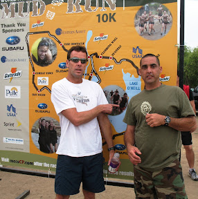 Tom "poster boy" Rowe and Bob check out the banner.