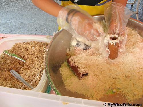 Rice flour, Fresh grated coconut and Coconut palm sugar are stuffed into bamboo tube