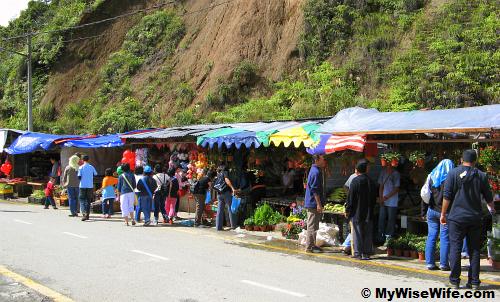 Wooden stalls set-up along the inner road beside a slope Wooden stalls set-up along the inner road beside a slope
