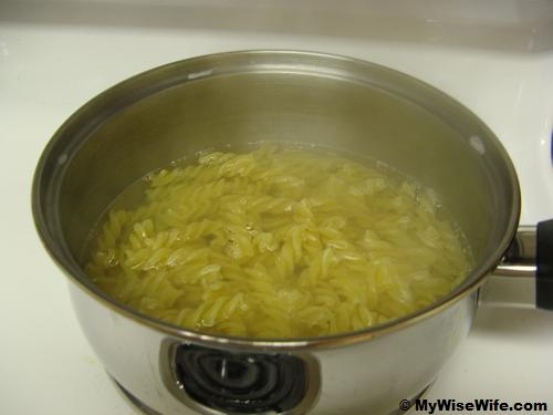 Bring water to boil to cook fusilli Bring water to boil to cook fusilli