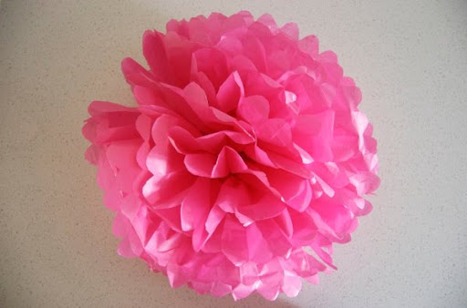 crepe paper flowers how to make. have two paper flowers.