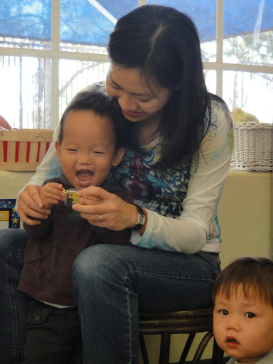 Aidan with his teacher, Ms Kwong