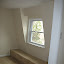 Attic, right of the stairs.