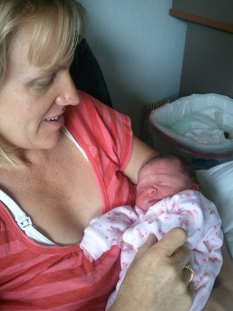 Renee with Baby Johanna Client of Nora McNeill Redding Midwife bonding with her newborn baby.