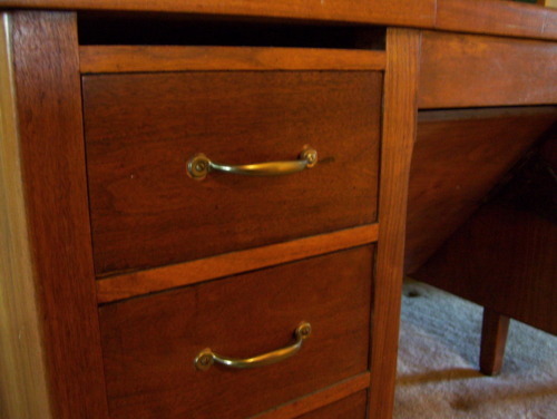 second desk, on the landing at the top of the stairs