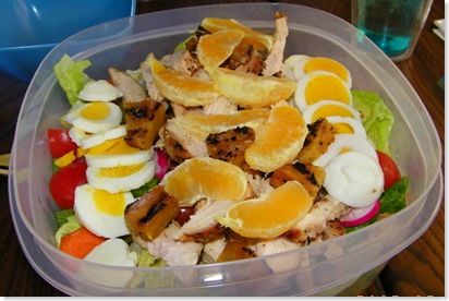 romaine, cherry tomatoes, green pepper, radishes, carrots, green olives, grilled chicken, grilled fresh pineapple, orange slices and boiled eggs with Kraft Seven Seas Italian dressing