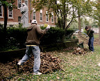 GenNext volunteers clean up the property around St. Vincent's Home for Children.