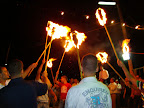 Begining of the celebration: the two groom are carried to the dance floor with people holding torched around them