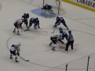 Penguins centre Jordan Staal battles Torontos Niklas Wallin on an overtime faceoff at Air Canada Centre, September 22, 2009.  The Maple Leafs won in a shootout 3-2.