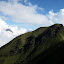 Merapi (left) emerges from the cloud next the summit of Merbabu