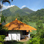 Our small bungalow with Penangungan in the background