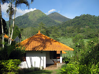 Our small bungalow with Penangungan in the background