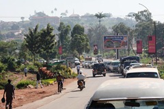 The red dirt seems to tint everything an ochre color in Kampala. And notice the cars driving on the left side. Very cool...
