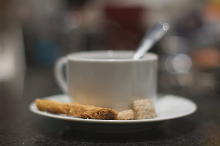 Coffee with lemon and lime polenta biscuits