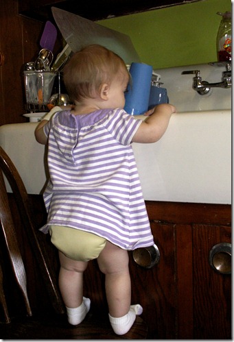 Elaine 10 months washing dishes