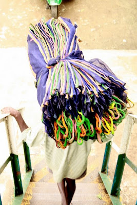 Worker carrying bags at a Sri Lankan tea factory near Hatton