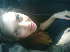 Candice scrunches down on the floor, in order to avoid police scrutiny of our overloaded vehicle