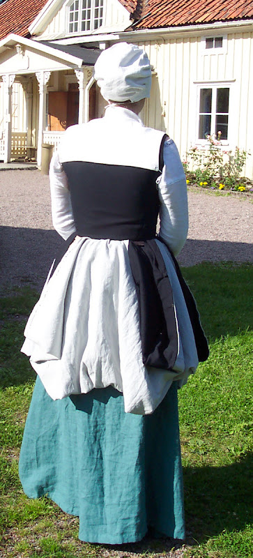 From the back with skirt tucked up