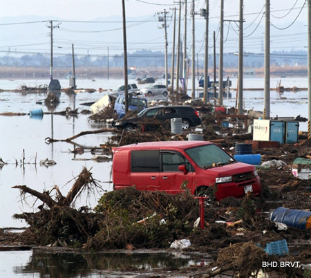 Cars and debris litter an area of Sendai city, Miyagi prefecture on March 12, 2011. More than 1,000 people were feared dead after a monster tsunami unleashed by a massive quake which wreaked destruction across northeast Japan and triggered an emergency at a nuclear power plant.  AFP PHOTO / JIJI PRESS