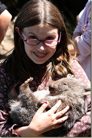 Sophie holding baby wombat Otto, Trowunna, Tasmania
