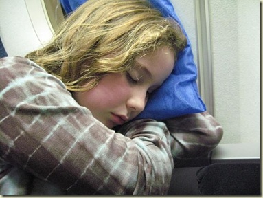 Elena sleeping on plane