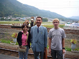With a visiting woman and Mr. Obiya.