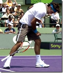 Federer breaking his racket