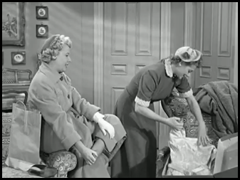 Lucy unwrapping her dress box