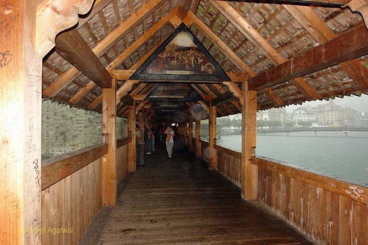 The wooden corridor of Chapel Bridge in Lucerne (Switzerland) when it was raining
